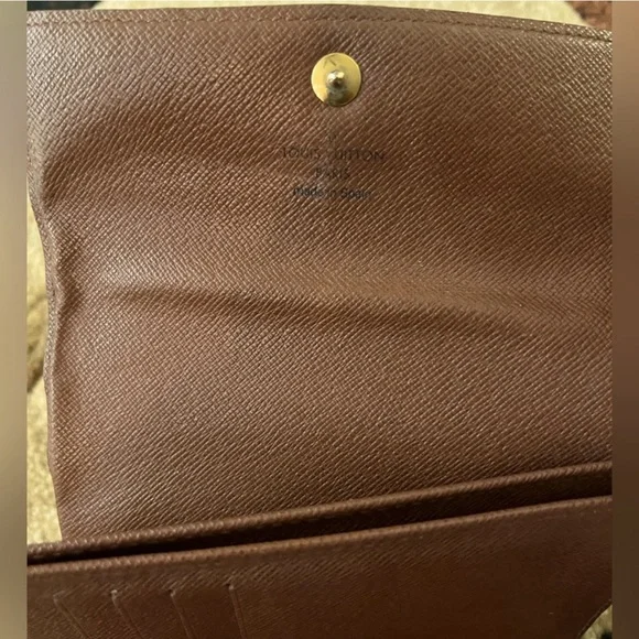 LOUIS VUITTONPortefeuille Alexandre Trifold Wallet w/ Dust Bag.